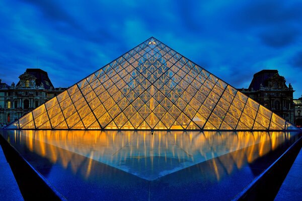 A glowing museum under the night sky