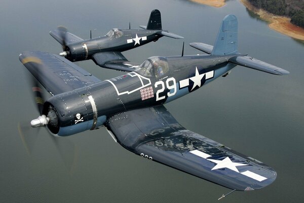 Corsair planes fly over the ocean