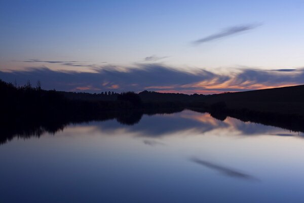 Evening sunset over the forest and lake