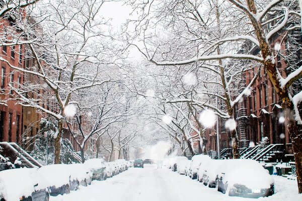 Snow-covered street of the winter city