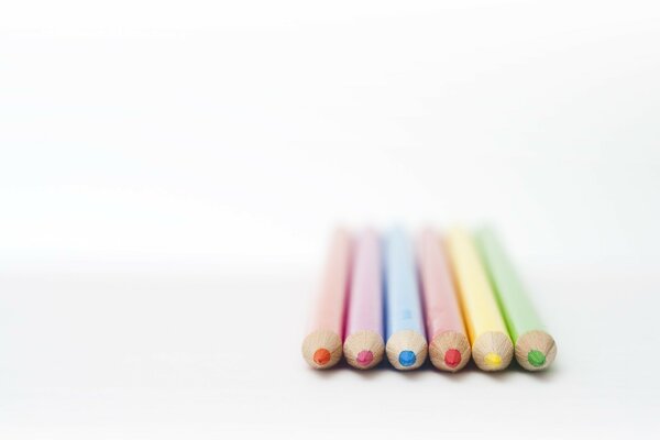 Colored pencils of green, yellow, red, blue, pink and orange colors