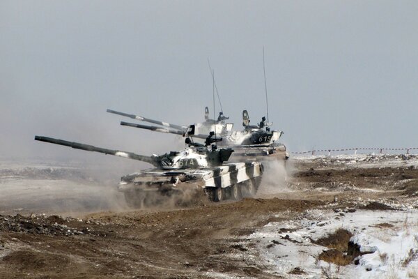 Black and white tanks in winter on the move