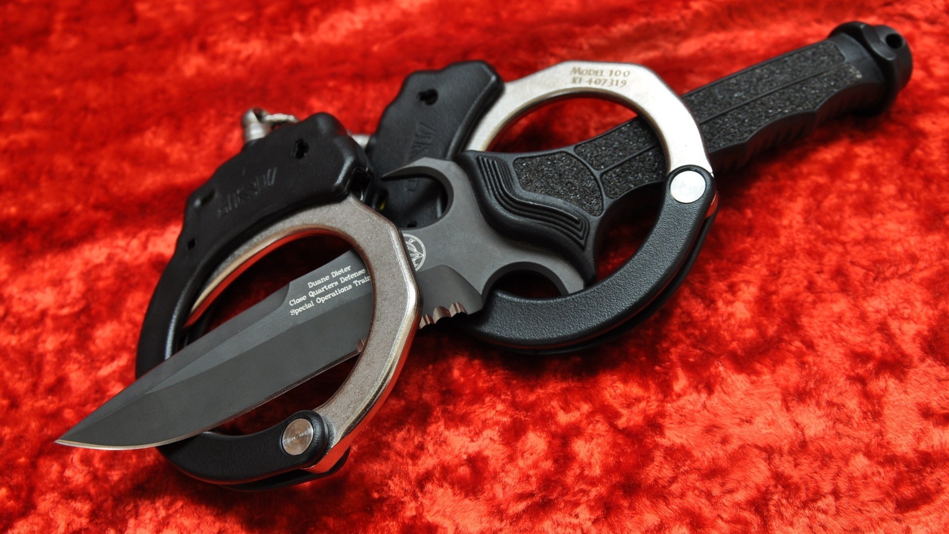 war knife red close up handcuff