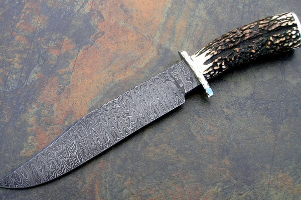 Damascus steel knife silver