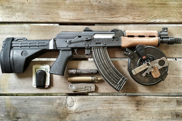 Kalashnikov assault rifle on a board with bucks