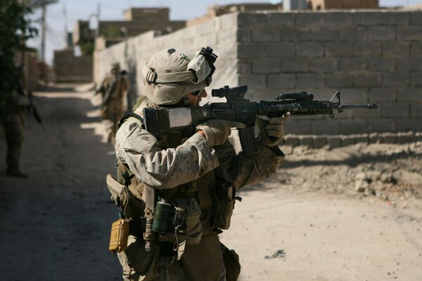 A soldier in a gray uniform in Iraq