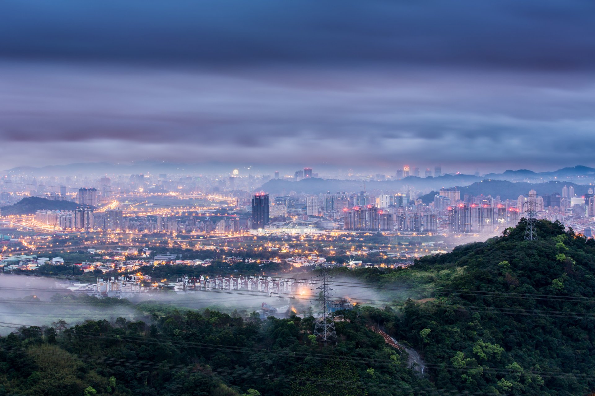 china prc taiwan taipei city dawn morning blue sky clouds fog haze lights lighting trees hills supports wires view height panorama