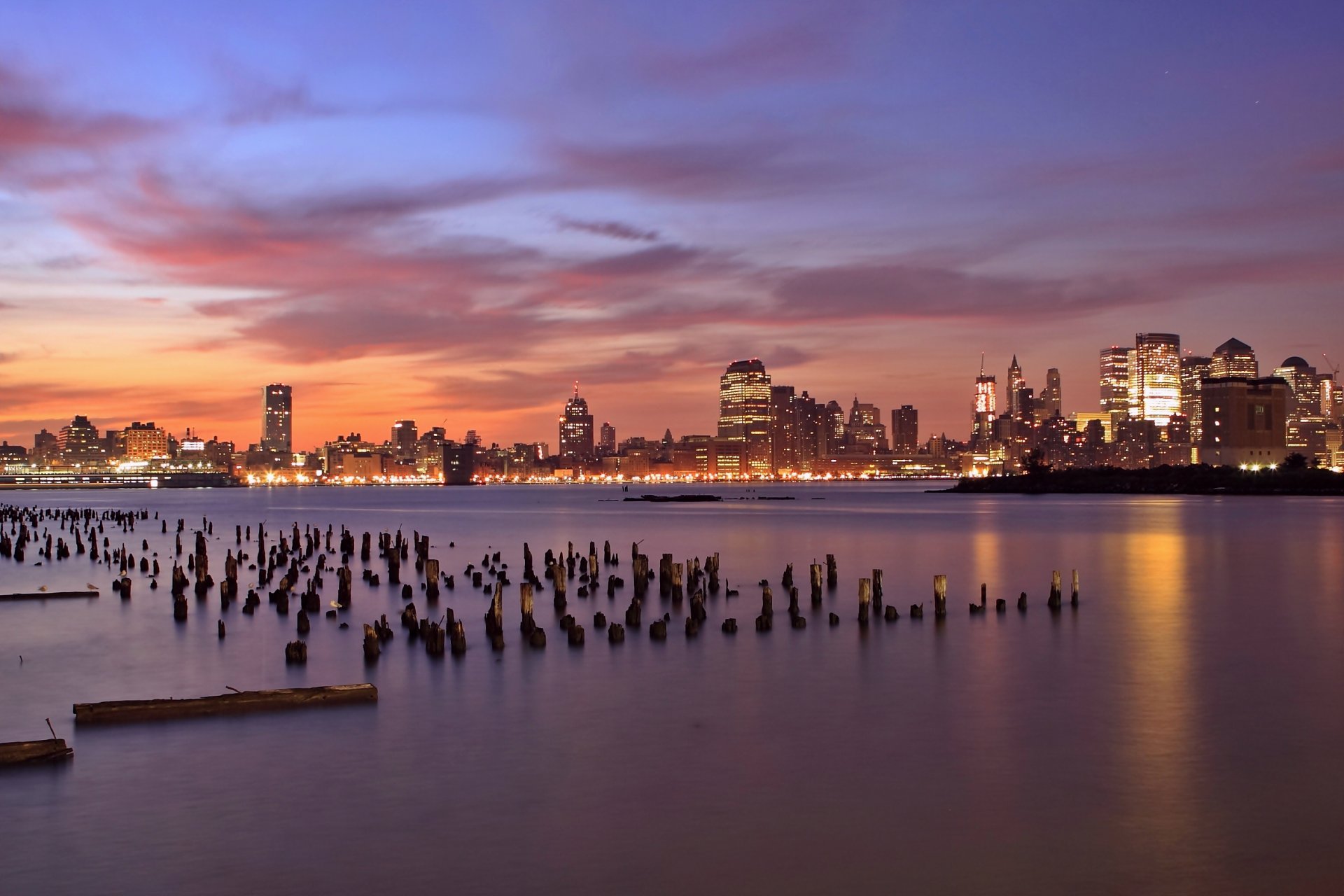 united states jersey city new jersey usa night orange sunset lilac sky clouds skyscraper light lights river hudson wooden bar