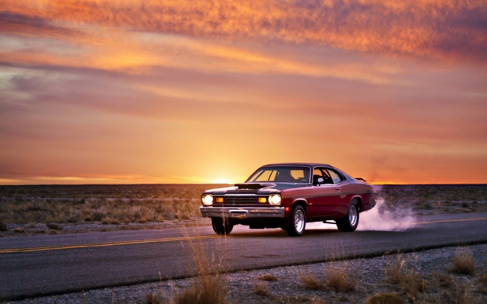 plymouth duster muscle car route coucher de soleil