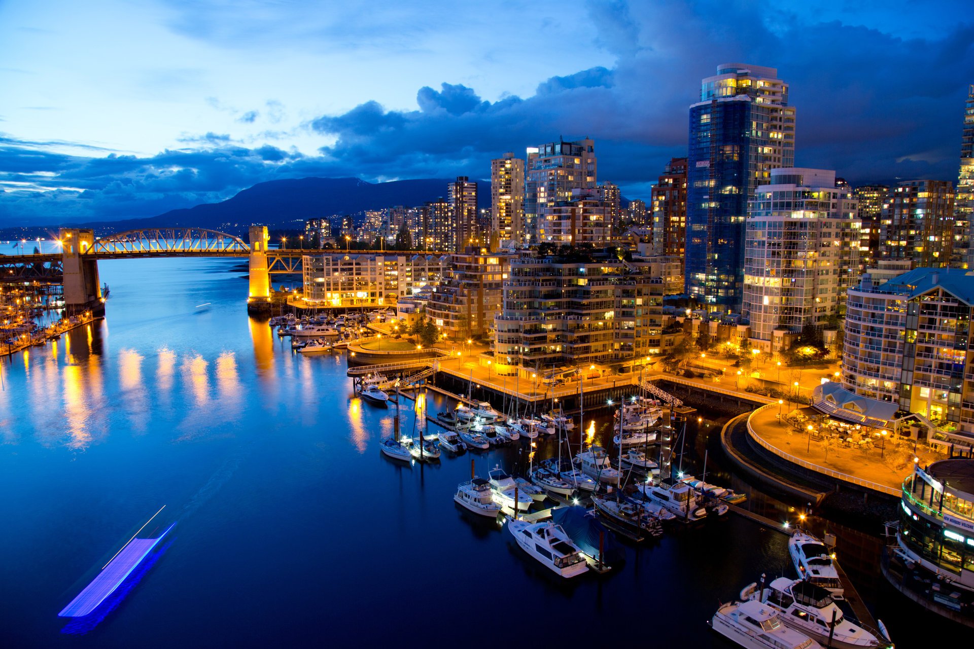 canada vancouver night buildings lights reflection water boat bridge pier