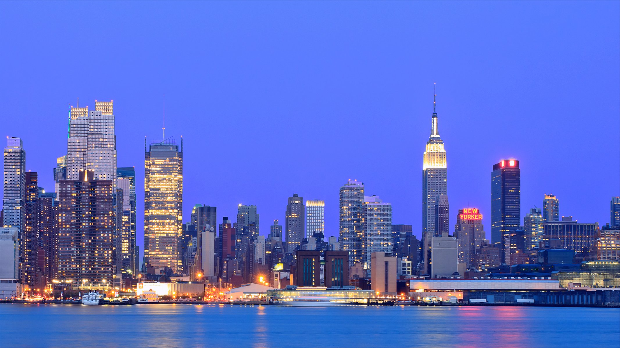 usa new york metropolis buildings skyscrapers evening illumination lights blue sky river