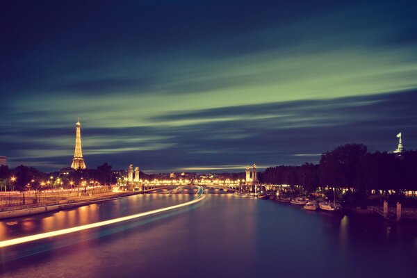 Luces de la noche París río torre efel