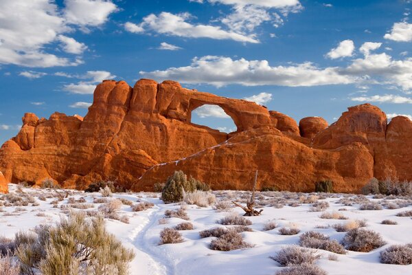 View of snow-covered rocks and desert