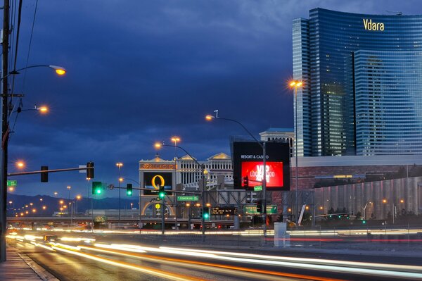 Las Vegas at night with lights of lanterns, traffic lights and high-rise buildings