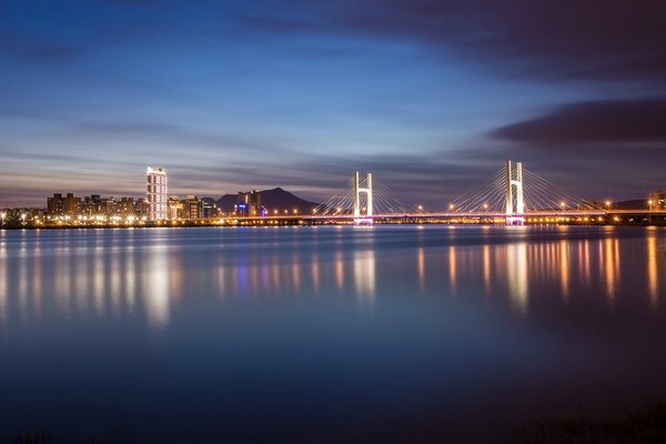 Bridge in lights over a river in China