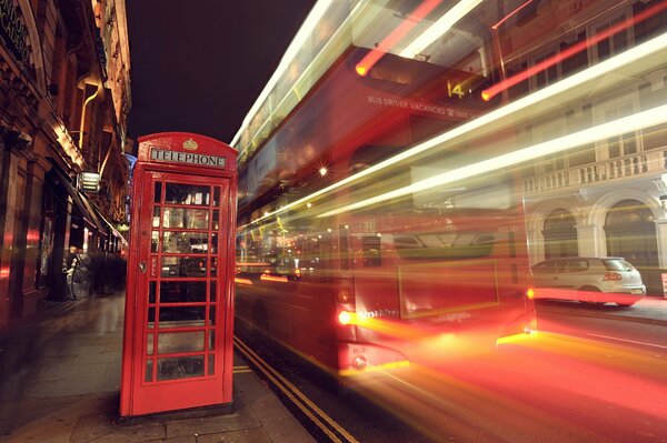 London telephone booth on the background of traffic