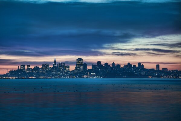 Night view of San Francisco on the background of the sea