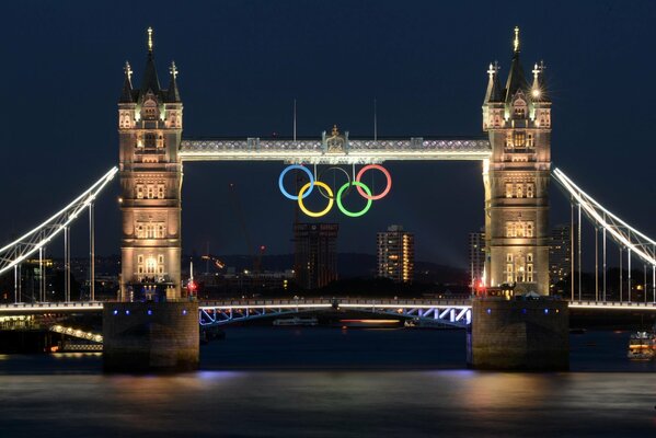 Bridge over the river with the symbols of the Olympics