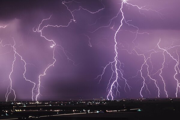 Lightning over the city in the night sky