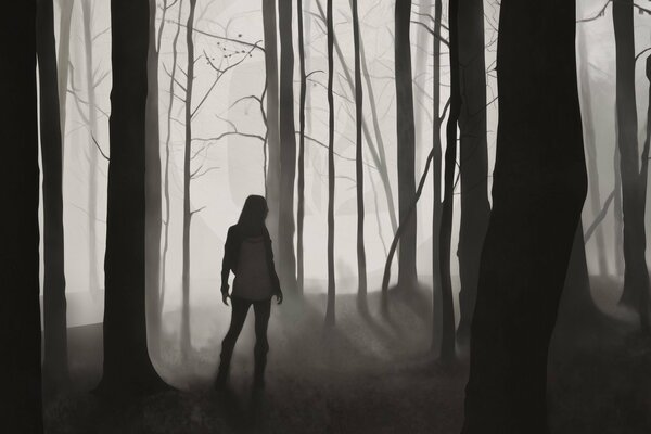 Silhouette of a girl in a gloomy forest