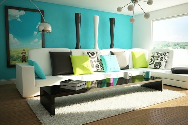 A corner white sofa with pillows and a long coffee table in front of it in the interior of a modern room. Interior