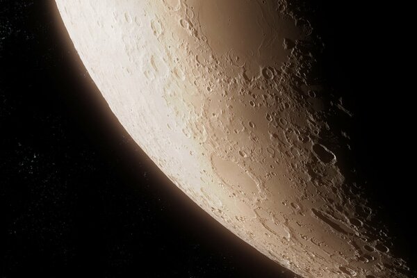 Illuminated surface of the moon with craters