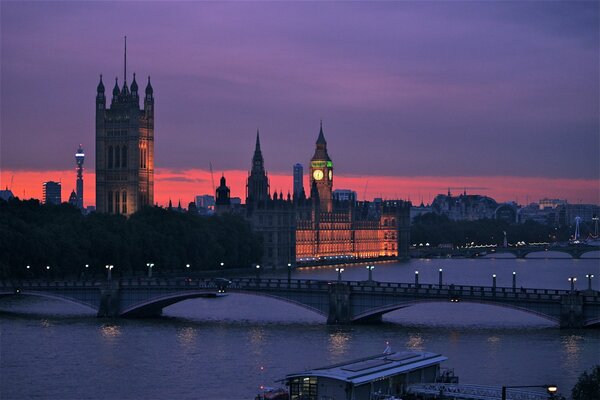 Bridge over the river at sunset lilac sky