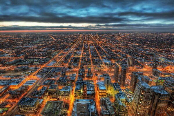 A night city with skyscrapers in the Midwest from a bird s eye view