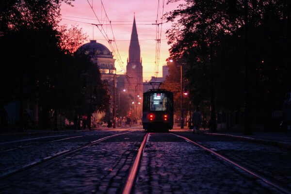 City tram in a pink sunset