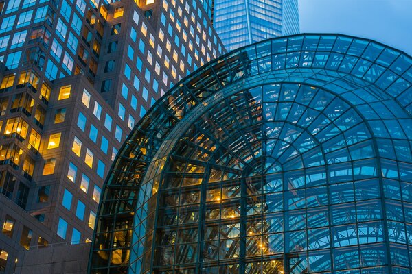 An unusual glass building in New York City at night