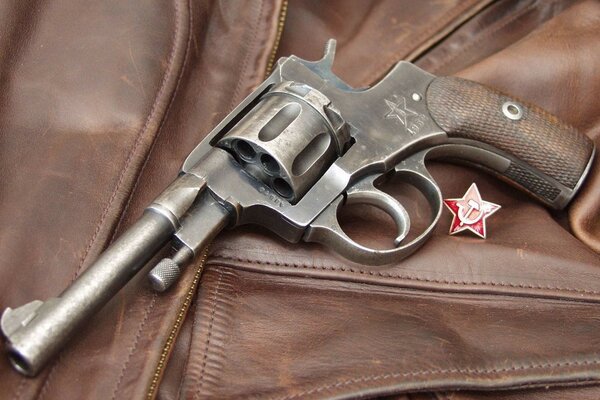 A revolver on a leather jacket