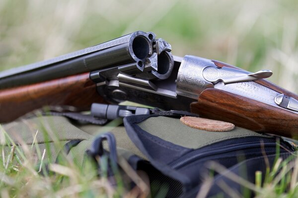 Macro photo of a double-barreled carbine in the grass