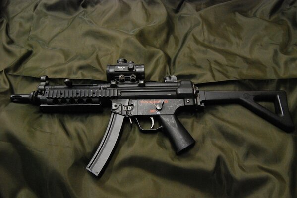 Polished mp5 weapon on a khaki background