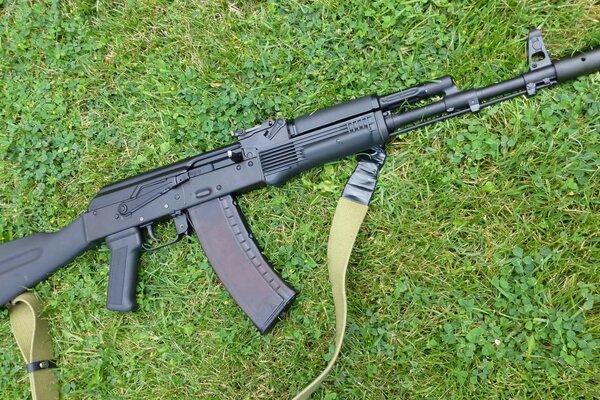 Title semi-automatic AK 47 on the grass