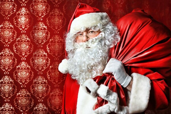 Święty Mikołaj z brodą i torbą z prezentami