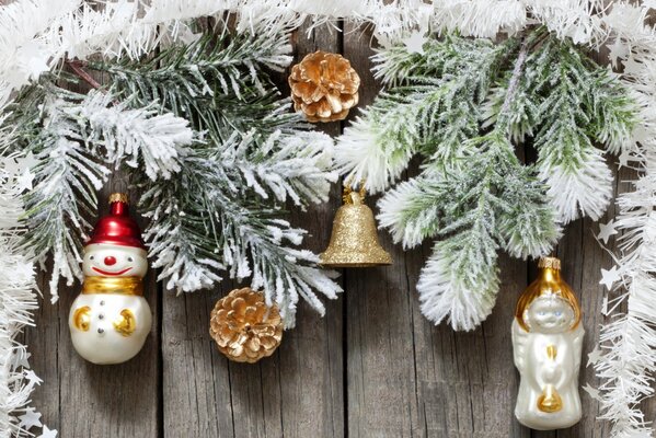 Snow-covered elegant spruce branches with glass toys