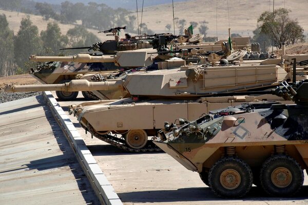 A parade of tanks lined up in a row