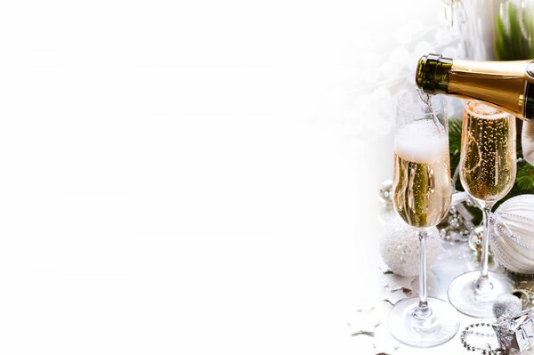 Glasses filled with champagne with foam