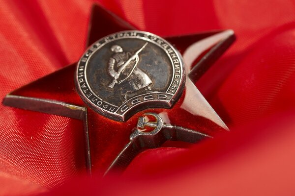 Star medal on red fabric