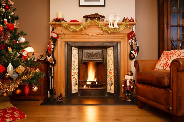 Cozy New Year s fireplace with a Christmas tree