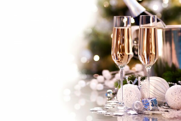 Champagne glasses and bright Christmas decorations