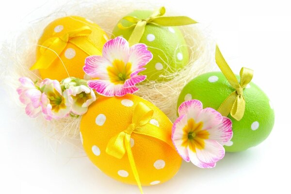 Easter eggs among flowers