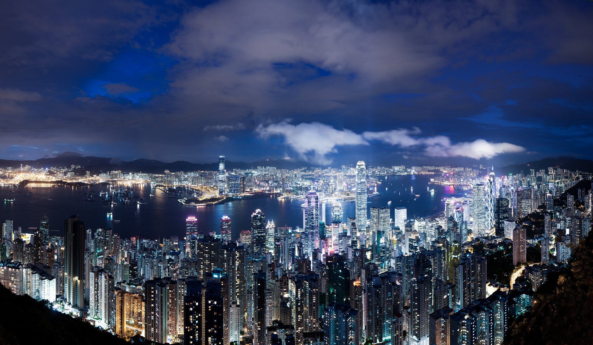 hong kong china noche metrópolis rascacielos luces retroiluminación azul cielo nubes panorama vista altura