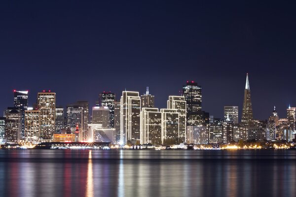 Buildings night water sky