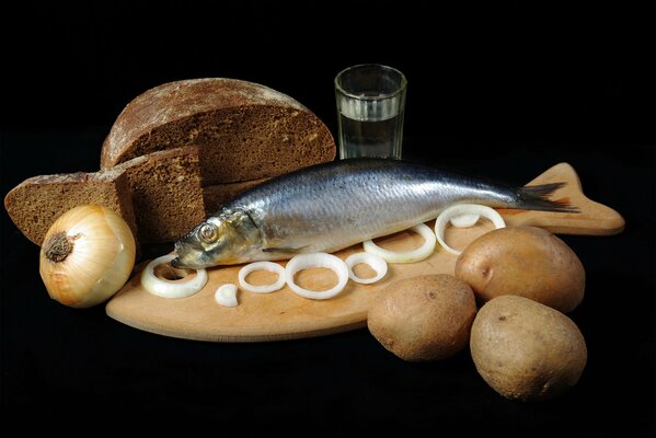 Aringa di Natura morta con cipolle, patate e pane