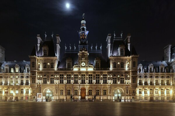 Glowing in the night lights of the Hotel de Ville in France t