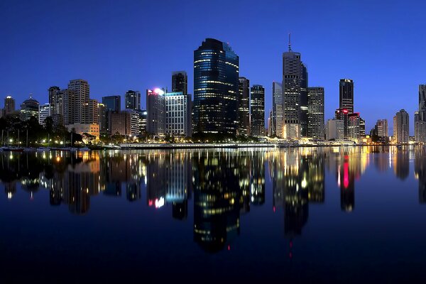 Evening glowing city by the water