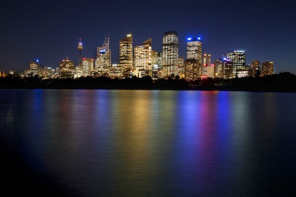 Skyline shopping center emits glare reflected in the water