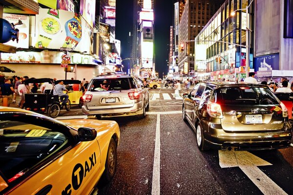 Cars on a bustling and bright New York street