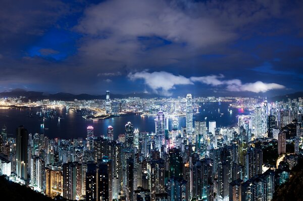 View of the city. Charming Hong Kong in lights on skyscrapers